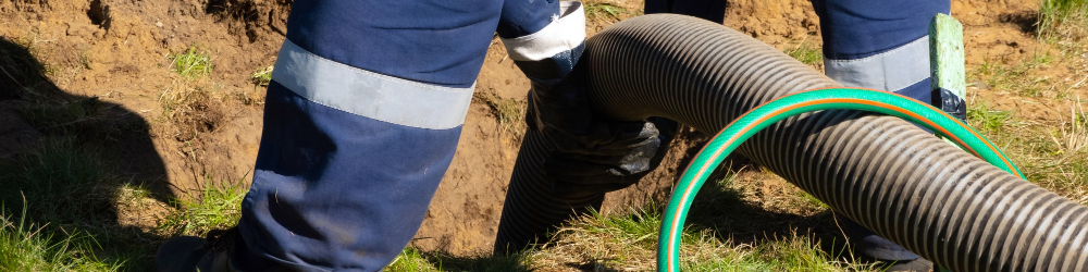 This man is performing one of the services that are necessary during a Mountain View septic pumping